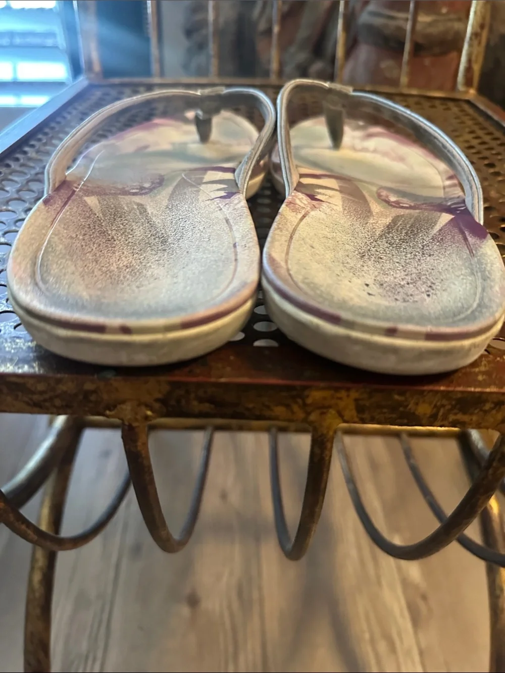 OluKai Metallic Silver Flip Flops with Purple Floral Accent